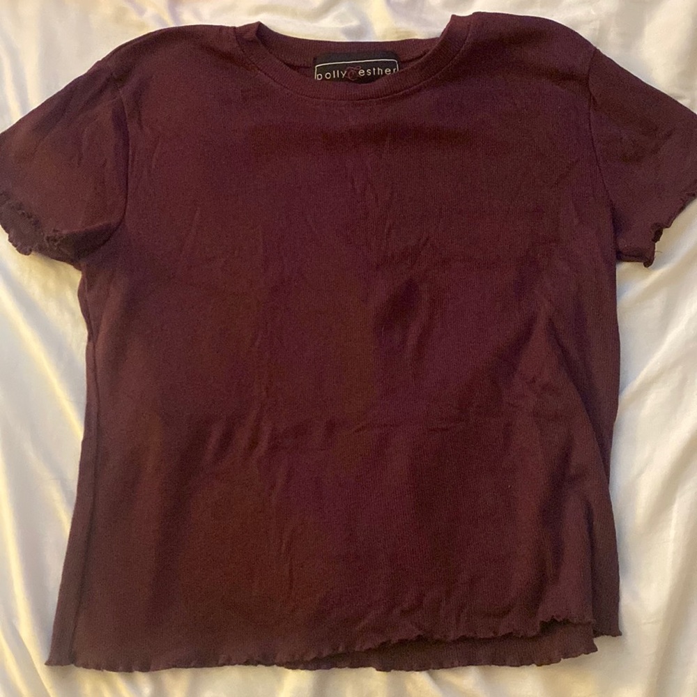 Size Large but fits like a medium, loose fit/ color purple